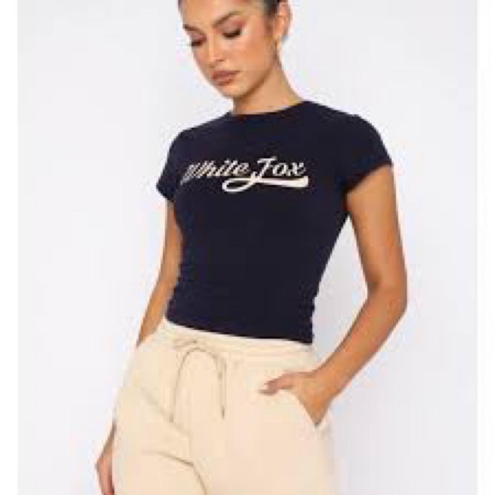 White Fox Boutique navy crop top with white 'White Fox' logo on front and bacK
